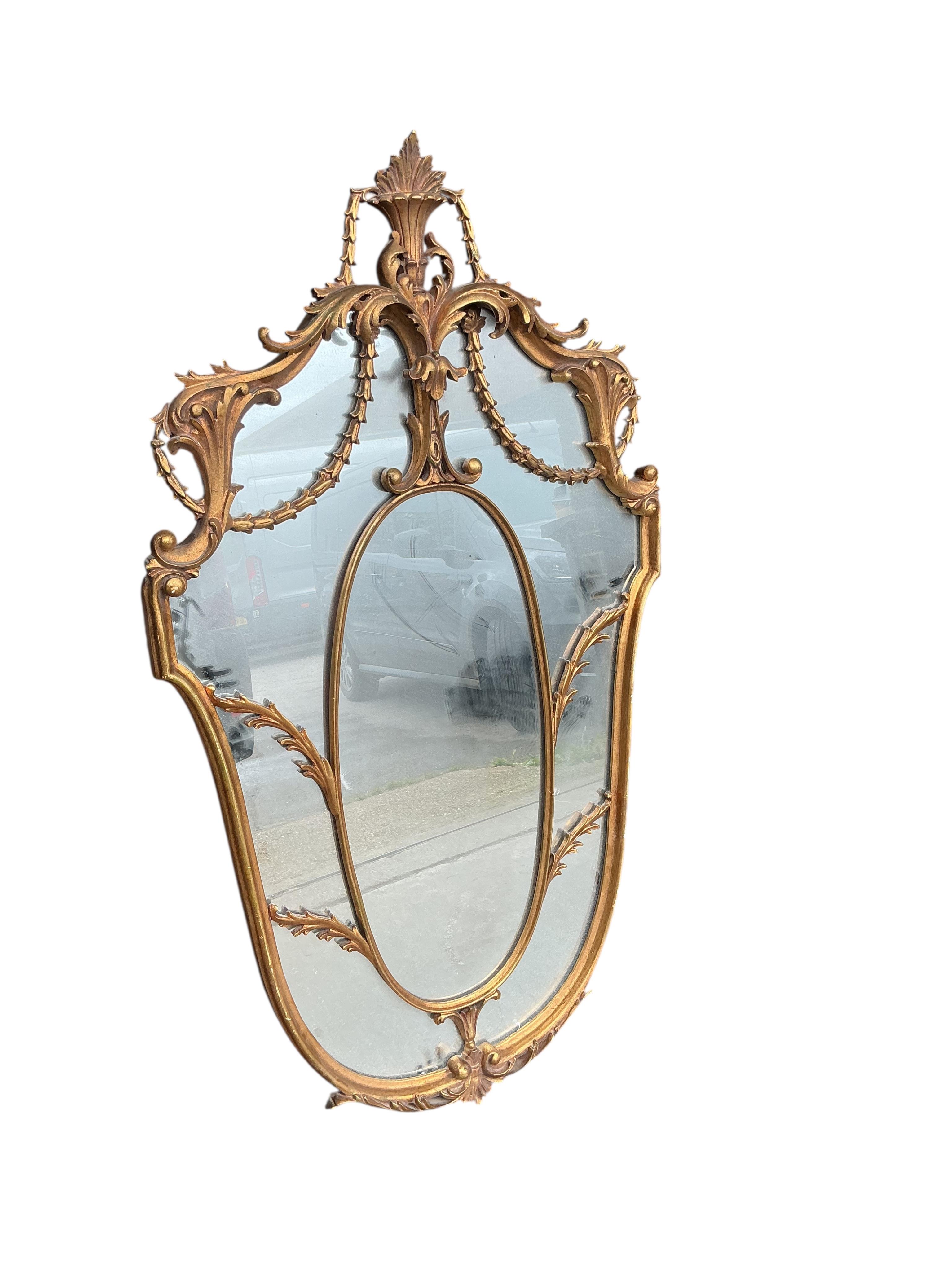 A decorative 18th century style Italian gilt composition wall mirror, width 70cm, height 126cm